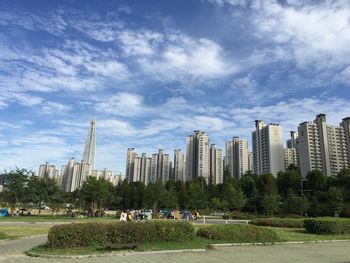 Buildings against cloudy sky