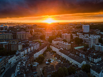 High angle view of city buildings during sunset