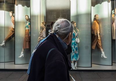 Group of people looking through window