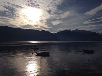 Scenic view of lake against cloudy sky