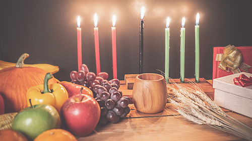 Lit candles on table