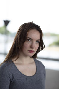 Portrait of young confident woman standing outdoors 