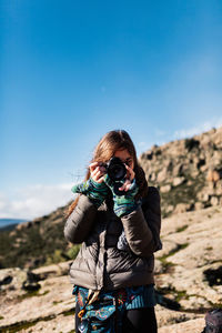 Woman photographing outdoors