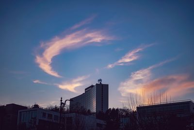 Low angle view of silhouette buildings against sky during sunset