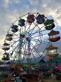 Low angle view of ferris wheel against sky