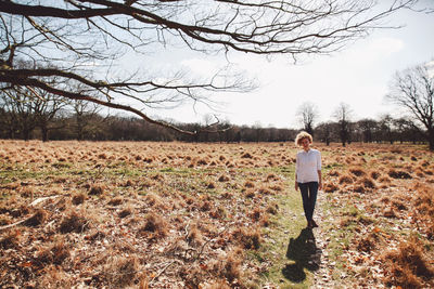 Full length of woman standing on field