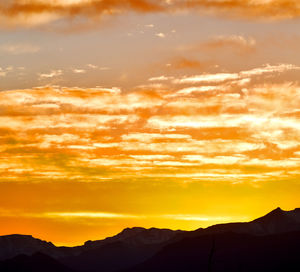 Scenic view of dramatic sky during sunset