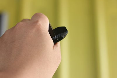 Close-up of hand on finger against blurred background