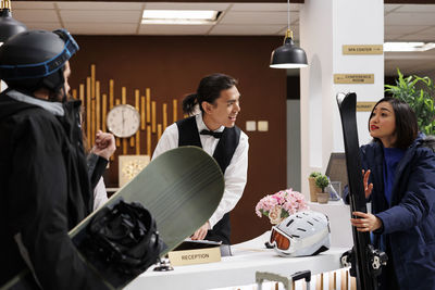 Side view of business colleagues working in office
