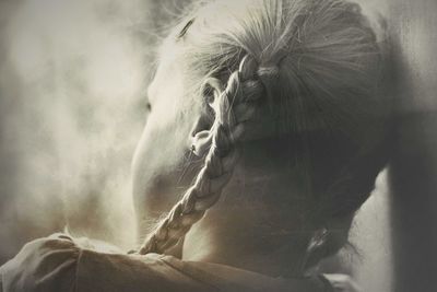 Close-up of girl in braided pigtails