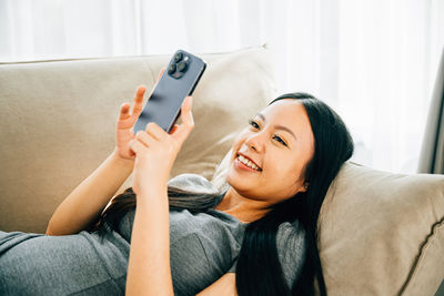 Young woman using mobile phone