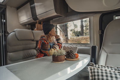 Mature man sitting in camper van