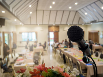 Low angle view of illuminated lighting equipment at home