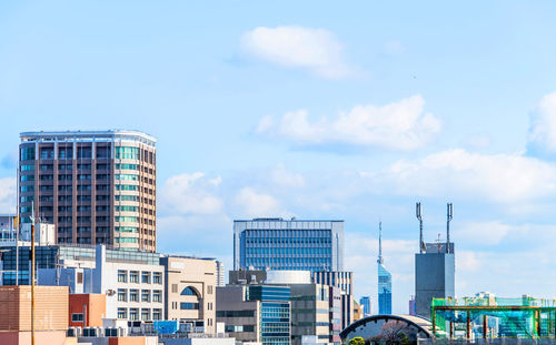 Modern buildings in city against sky