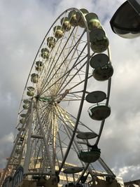 Low angle view of ferris wheel against sky