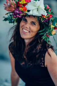 Portrait of woman wearing multi colored flowers