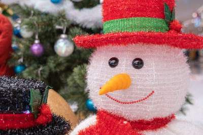 Close-up of christmas decorations on tree during winter