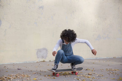 A young woman on a skateboard