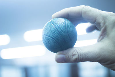 Close-up of hand holding ball