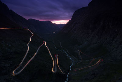 High angle view of light trail on mountain road at dusk