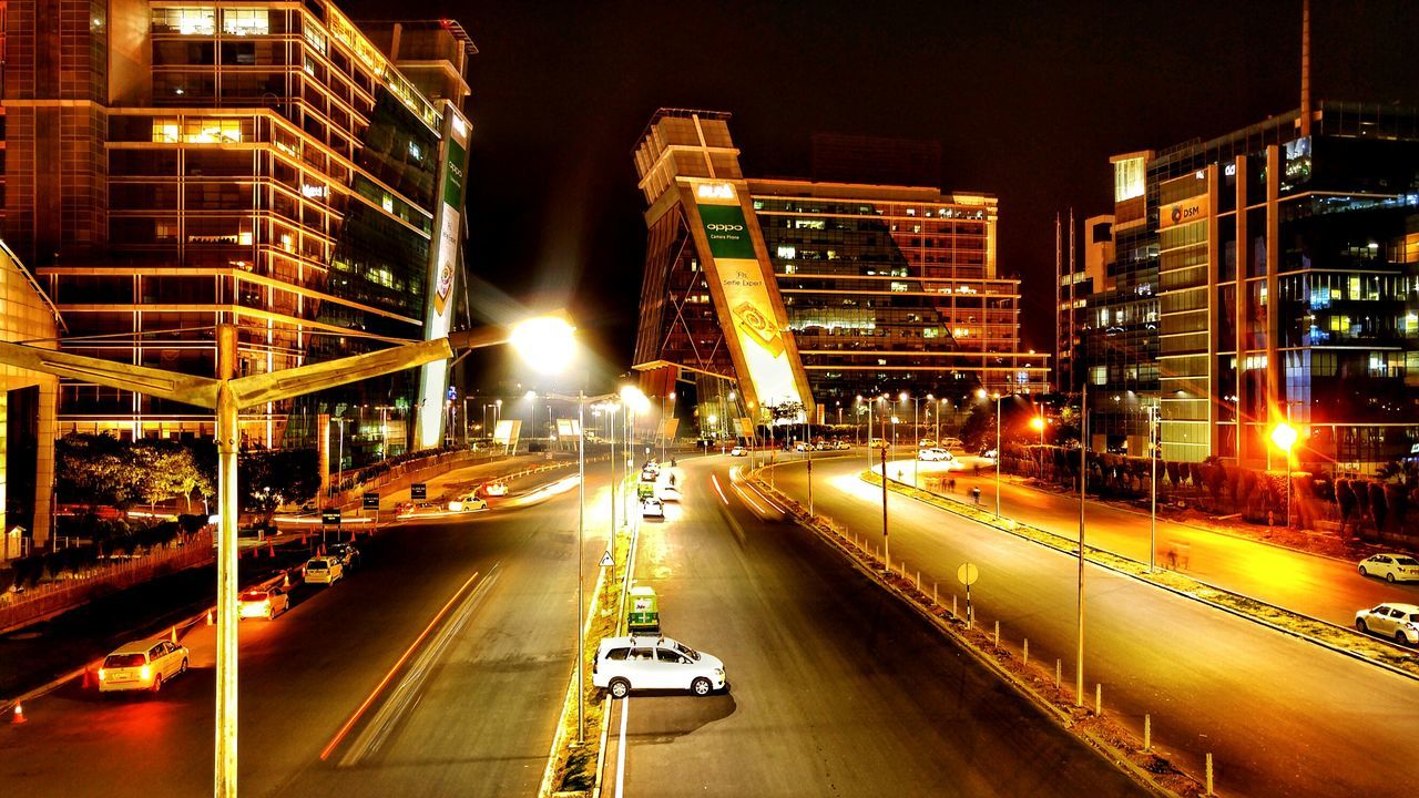 ILLUMINATED CITY STREET AT NIGHT