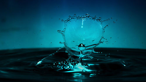 Close-up of drop splashing in water