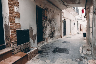 Empty alley amidst buildings