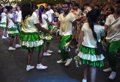 Group of people dancing at music concert