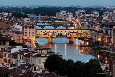 High angle view of bridge over river and buildings in city