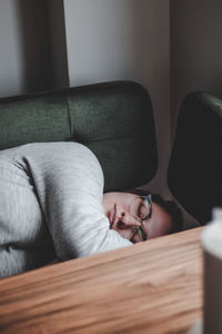 High angle view of woman lying on seat