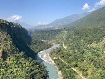 High angle view of trees and mountains against sky