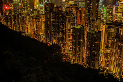 High angle view of illuminated buildings in city at night