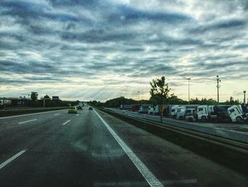 View of road against cloudy sky