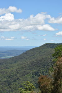 Scenic view of mountains against cloudy sky