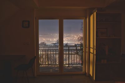 Buildings seen through window of house