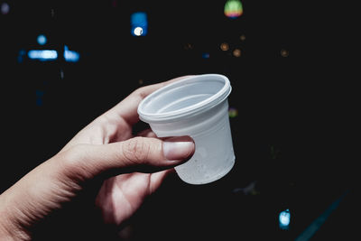 Close-up of hand holding drink