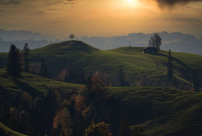 Scenic view of landscape against sky during sunset