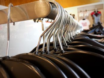 Close-up of clothes hanging on rack in store