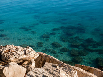 High angle view of rocks in sea