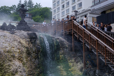 View of waterfall along buildings