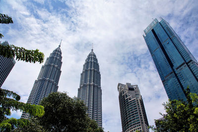 Low angle view of klcc park with petronas towers