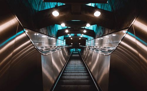 Low angle view of illuminated escalator