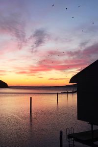 Scenic view of sea against sky at sunset