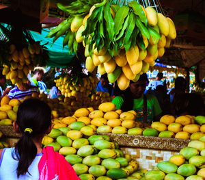 Rear view of fruit for sale at market stall