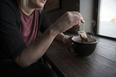 Woman having tea