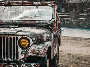 Close-up of abandoned car