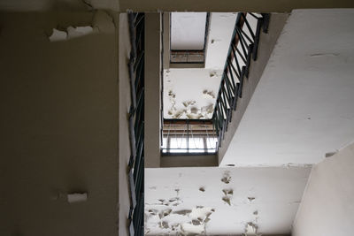 Low angle view of staircase in abandoned building