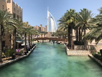 View of swimming pool by buildings in city