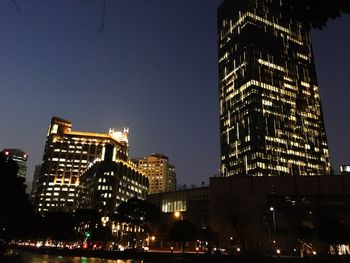 Low angle view of illuminated buildings at night