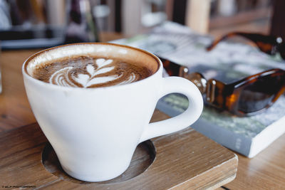 Close-up of cappuccino on table